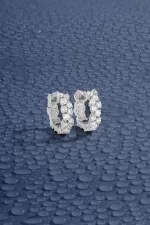 APM Monaco Boucles d’oreilles Huggie pavées Argent Sterling