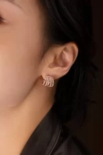 APM Monaco Boucles d’oreilles à cinq anneaux Plaqué Or Rose 18 Carats